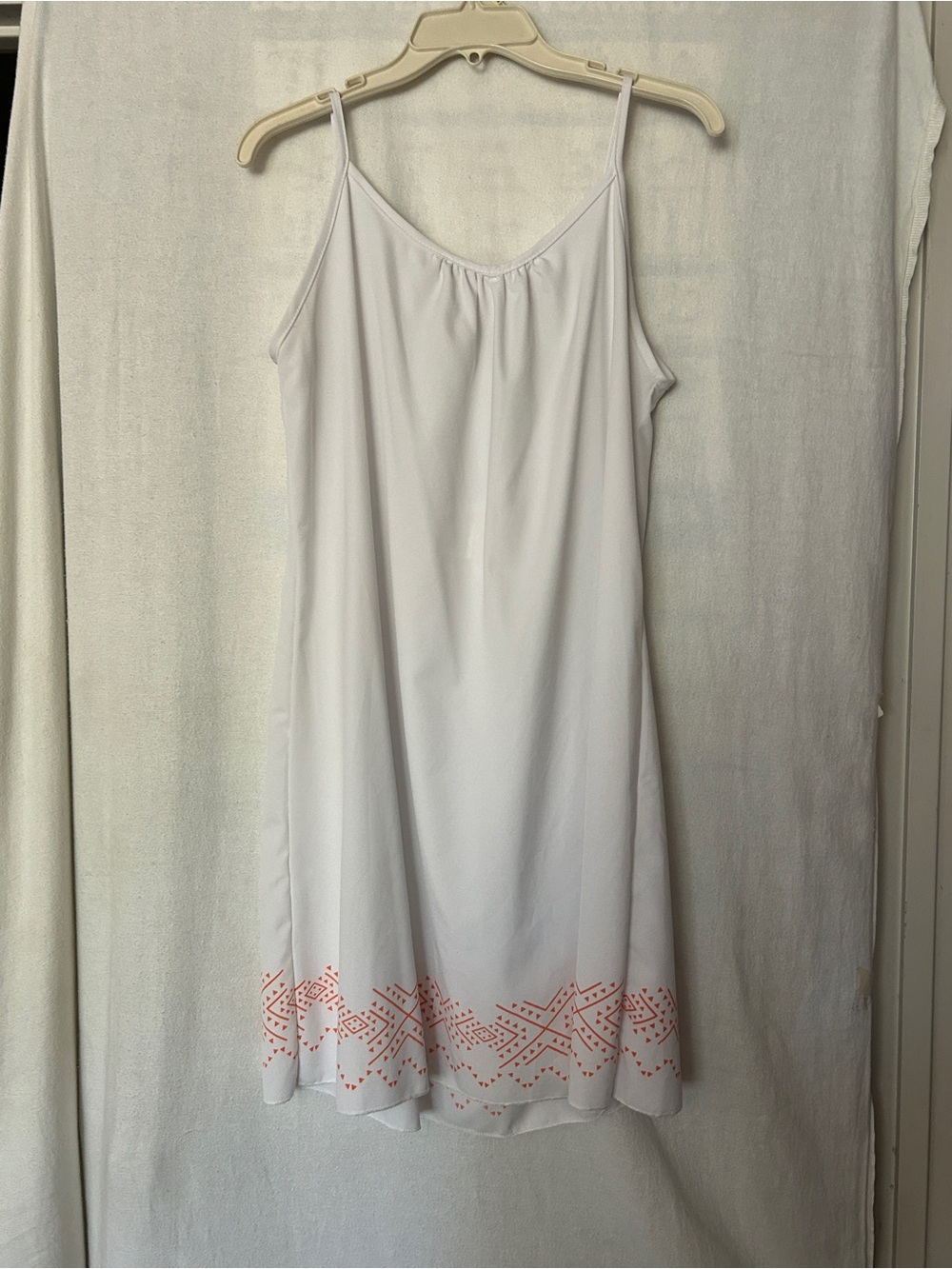 Women's White Dress drapes down in back with Coral Hem Embroidery
